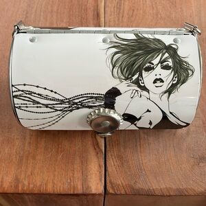 Little Earth cylinder purse